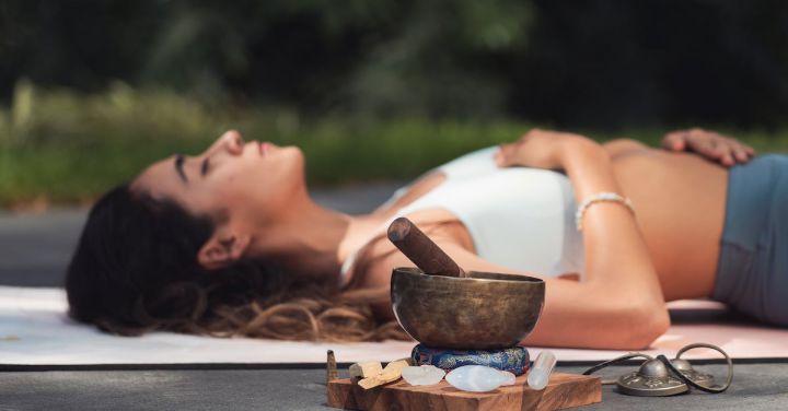 Relaxation Spots - Woman Lying on Blue Yoga Mat