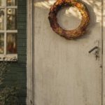 Ghost Stories - White Wooden Door With A Wreath